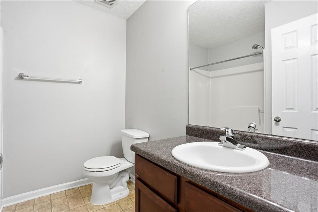 2157 Capella Circle Southwest Atlanta, GA 30331 - Photo 19 of 41 a bathroom with a sink toilet and a mirror