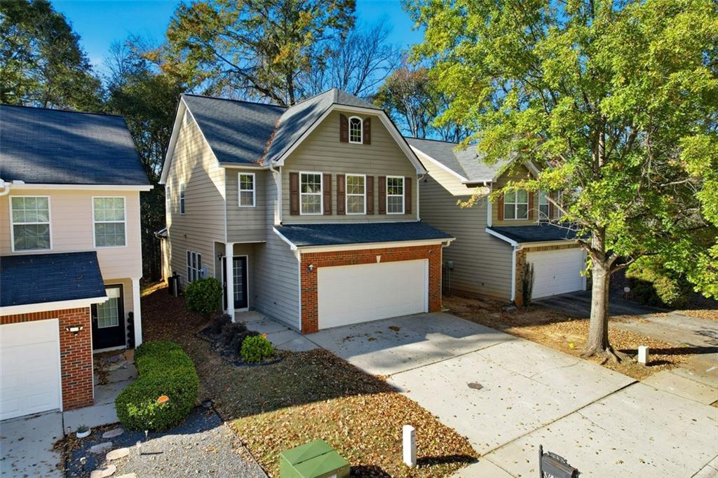 2157 Capella Circle Southwest Atlanta, GA 30331 - Photo 2 of 41 a front view of a house with a yard