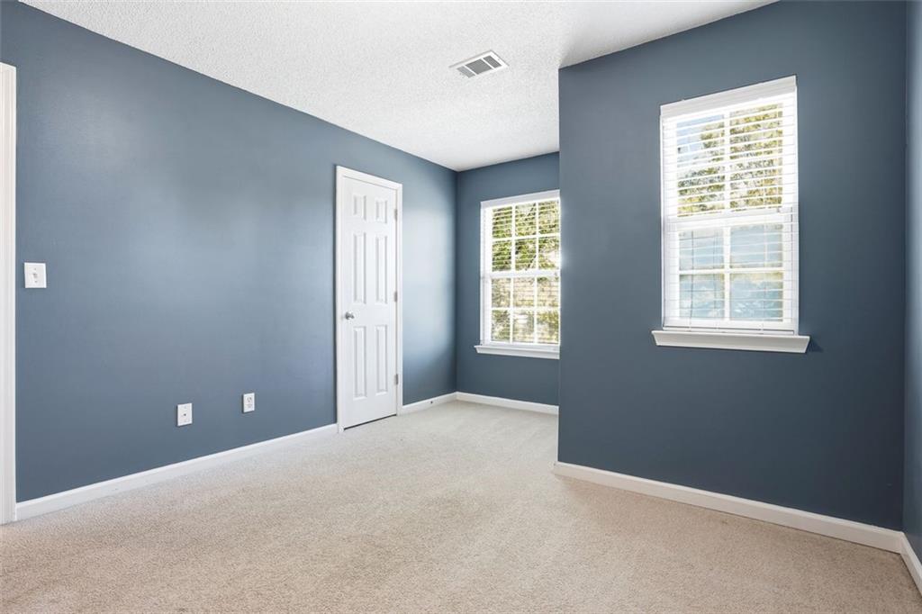 2157 Capella Circle Southwest Atlanta, GA 30331 - Photo 21 of 41 an empty room with windows and closet