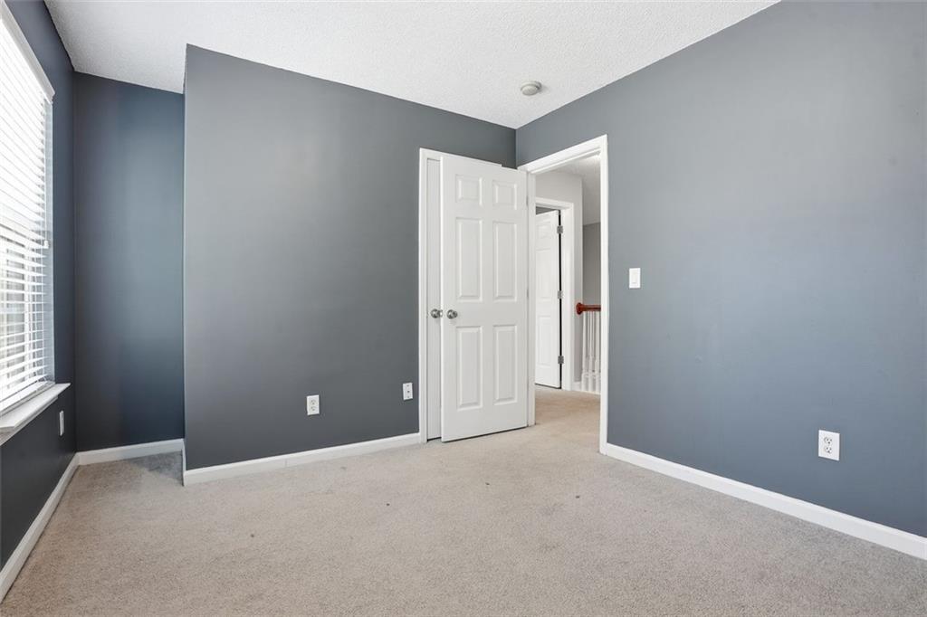2157 Capella Circle Southwest Atlanta, GA 30331 - Photo 23 of 41 an empty room with windows and closet