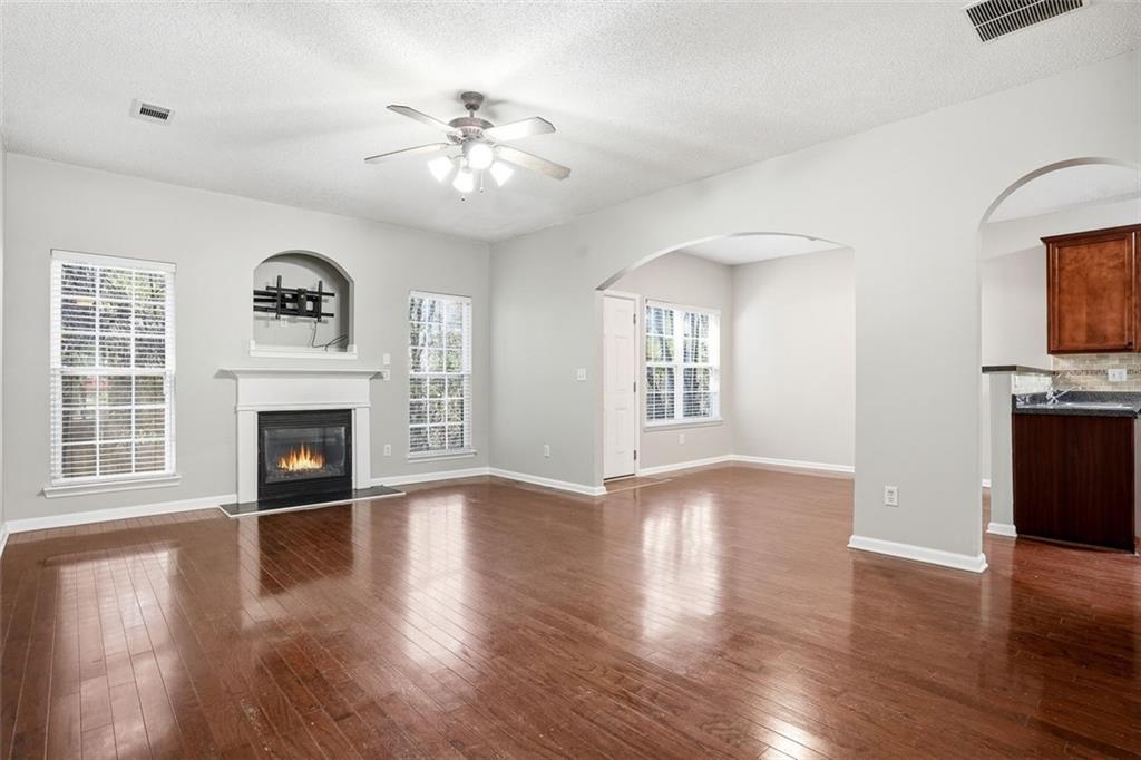 2157 Capella Circle Southwest Atlanta, GA 30331 - Photo 5 of 41 a view of a livingroom with a fireplace wooden floor and a window