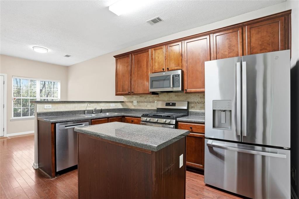 2157 Capella Circle Southwest Atlanta, GA 30331 - Photo 8 of 41 a kitchen with a refrigerator sink and microwave