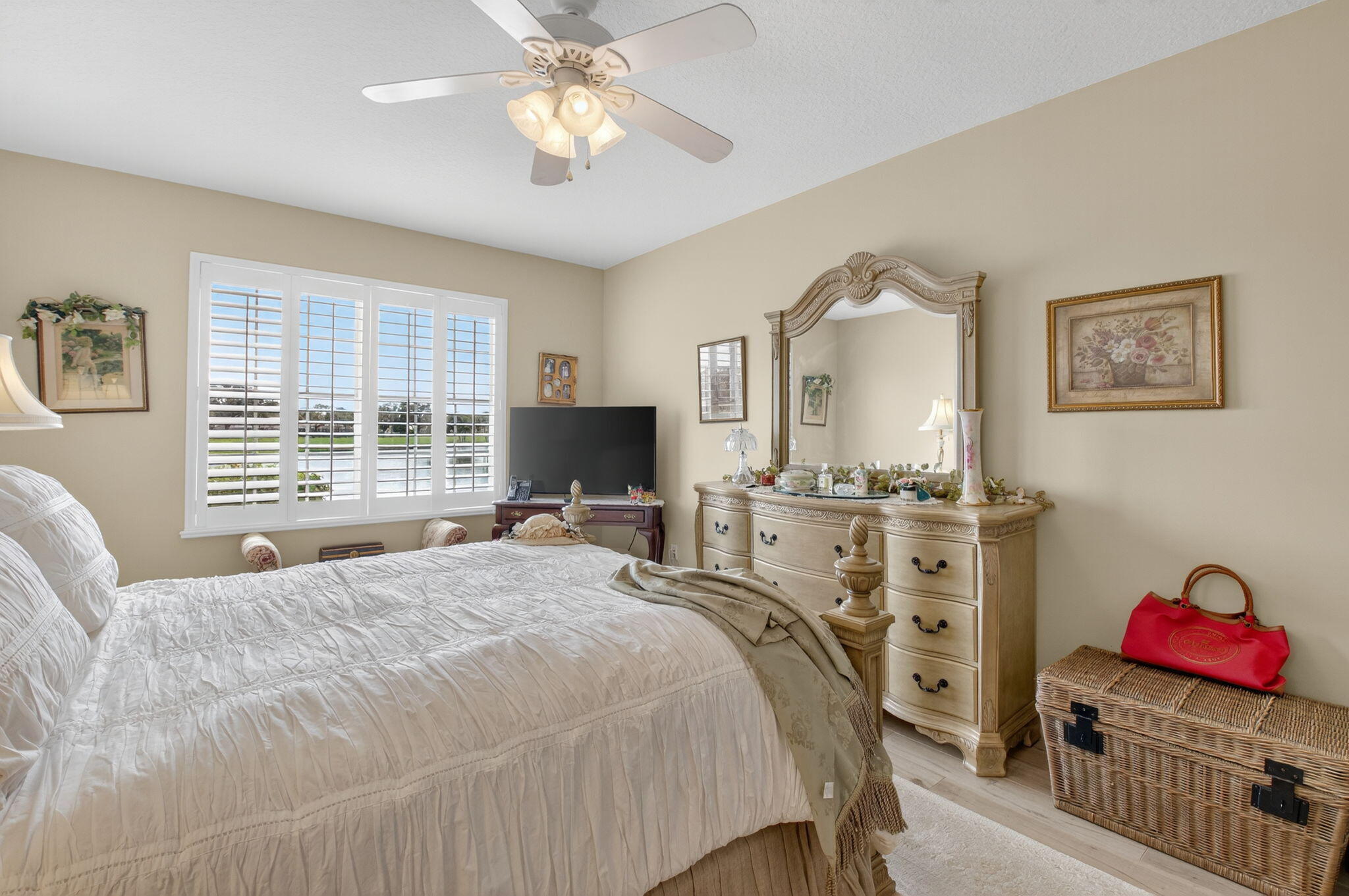 17287 Boca Club Boulevard, Unit 1 Boca Raton, FL 33487 - Photo 15 of 28 a bedroom with a bed and a flat screen tv