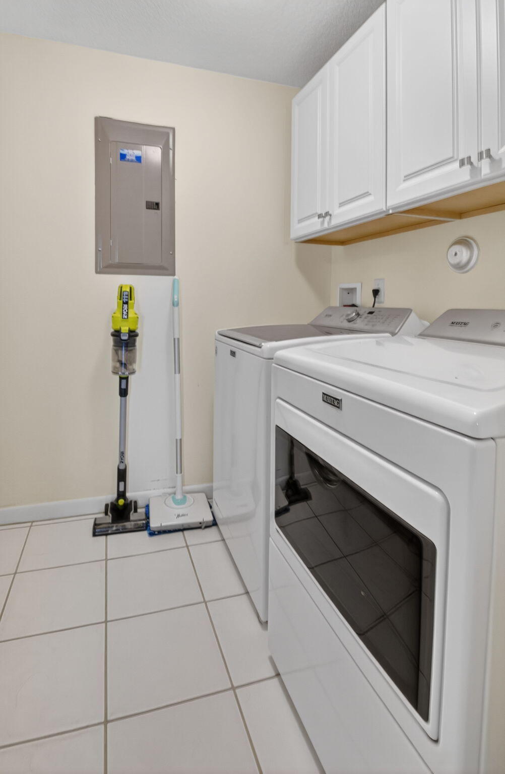 17287 Boca Club Boulevard, Unit 1 Boca Raton, FL 33487 - Photo 21 of 28 a kitchen with a stove and cabinets