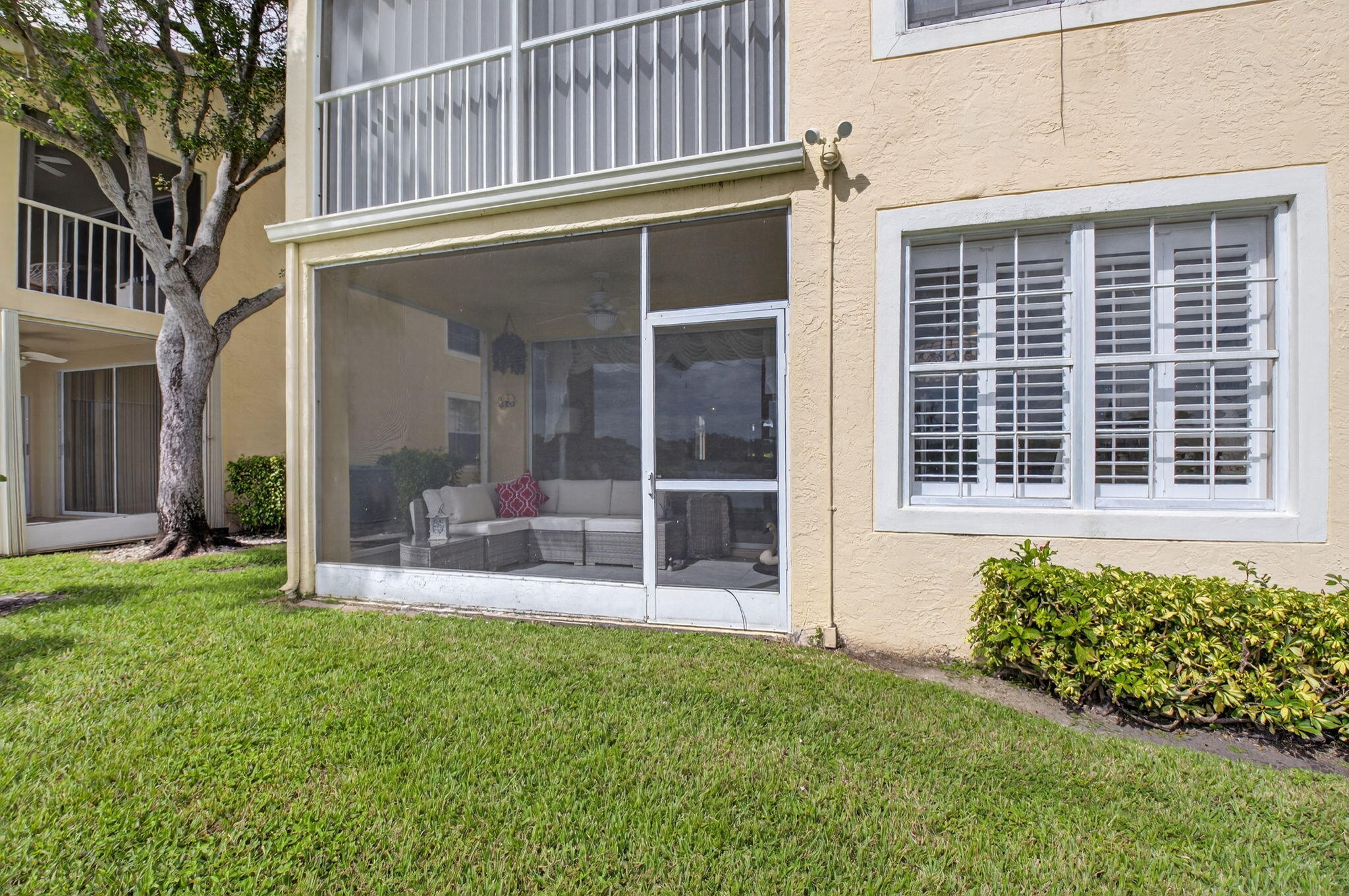 17287 Boca Club Boulevard, Unit 1 Boca Raton, FL 33487 - Photo 24 of 28 front view of a house with a yard