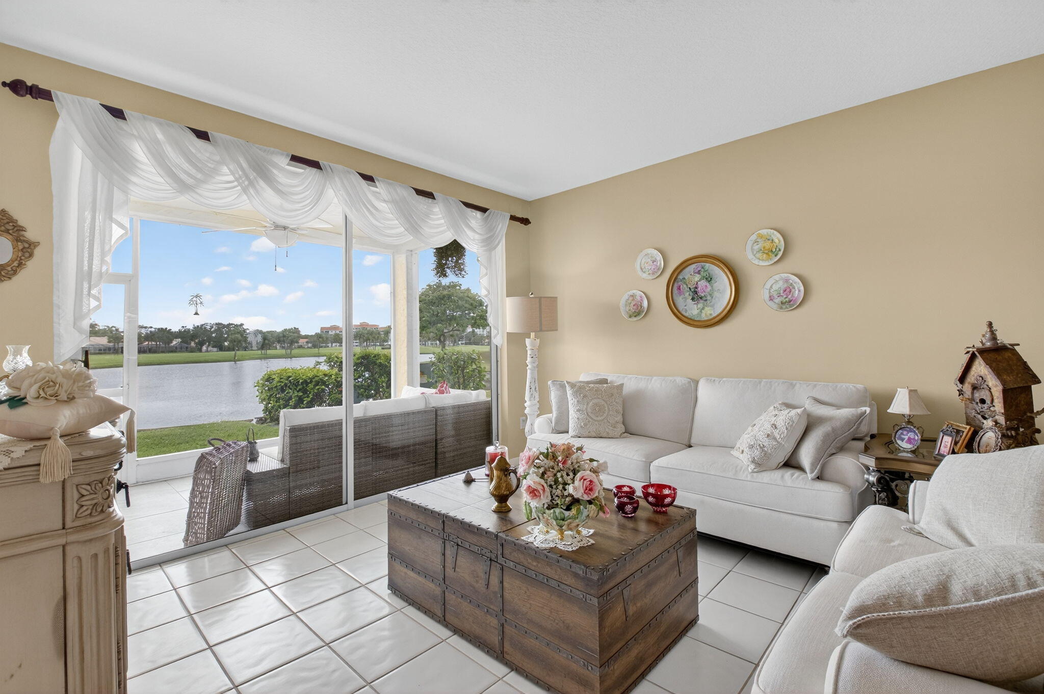 17287 Boca Club Boulevard, Unit 1 Boca Raton, FL 33487 - Photo 6 of 28 a living room with furniture and a large window