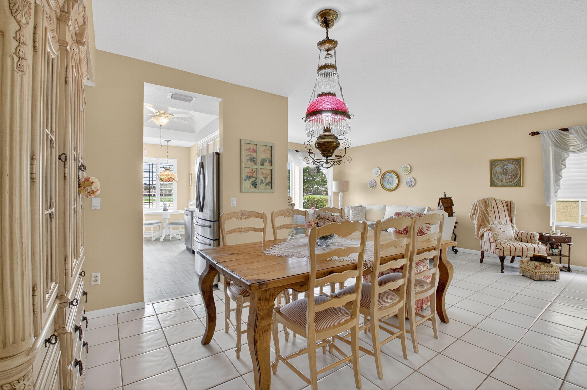 17287 Boca Club Boulevard, Unit 1 Boca Raton, FL 33487 - Photo 8 of 28 a view of a dining room with furniture and chandelier