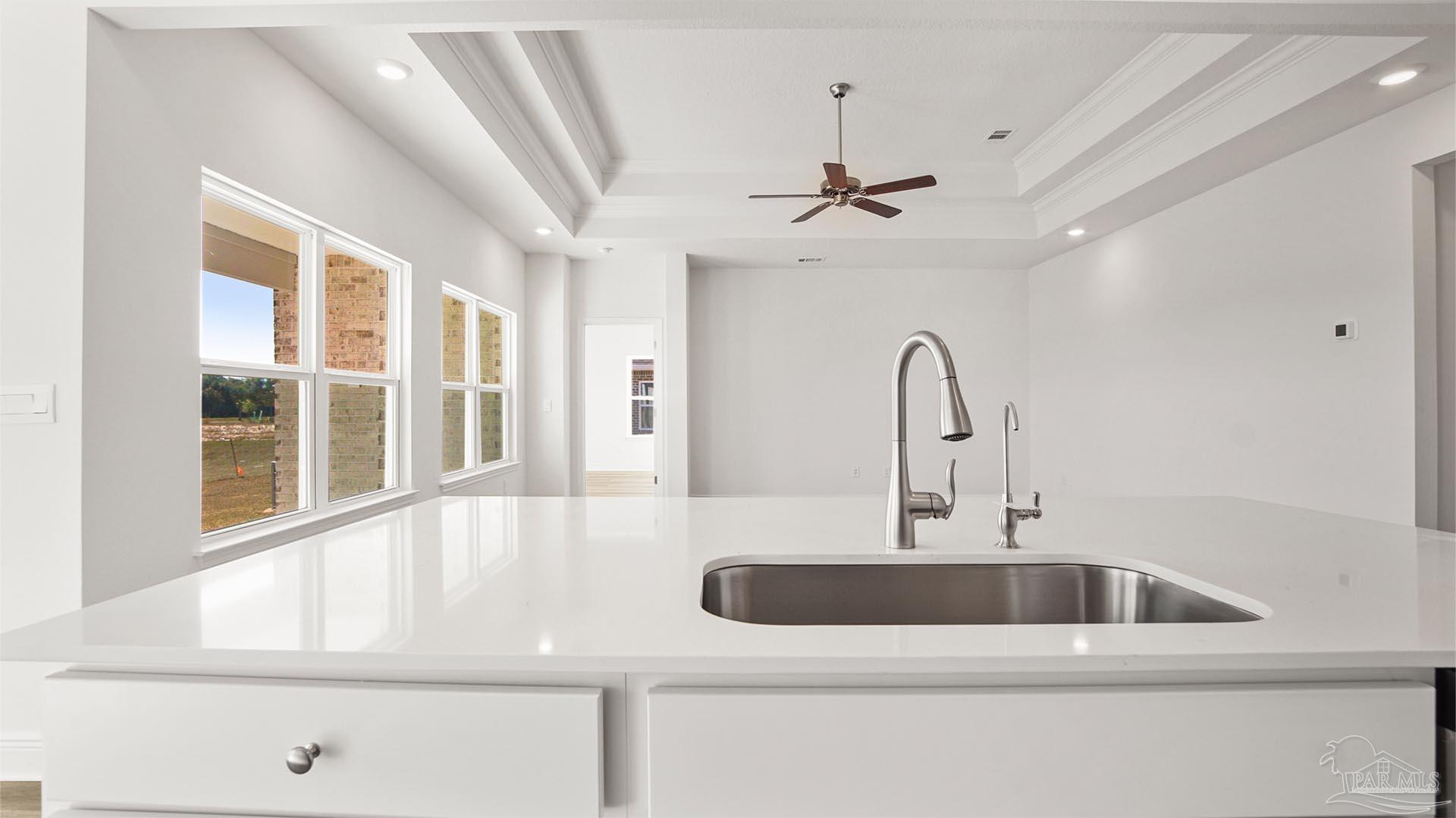 8664 Bluebell Street Milton, FL 32583 - Photo 8 of 28 a kitchen with a sink and chandelier