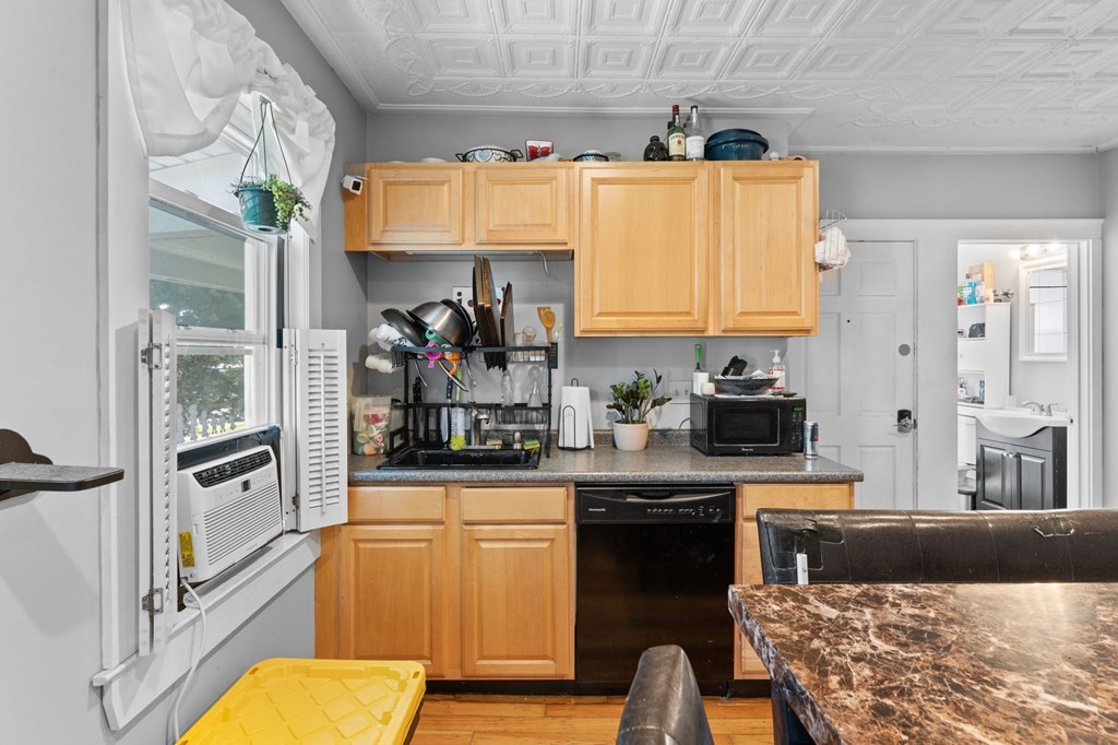21 Russell Street Taunton, MA 02780 - Photo 19 of 42 a kitchen with a refrigerator and a stove top oven