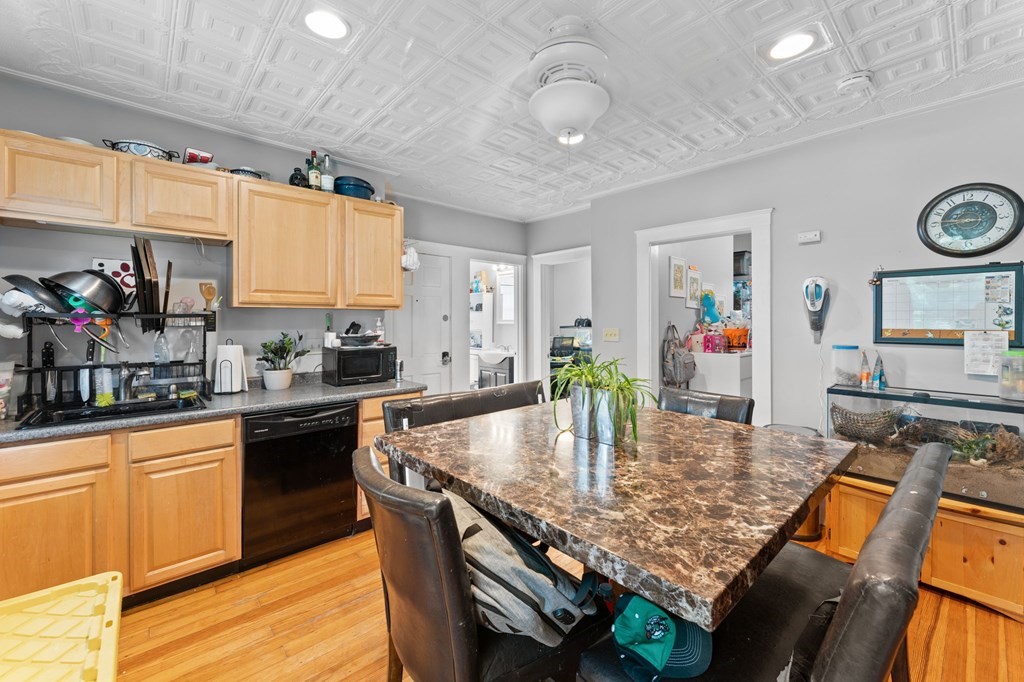 21 Russell Street Taunton, MA 02780 - Photo 20 of 42 a kitchen with stainless steel appliances granite countertop a stove top oven a sink dishwasher and cabinets with wooden floor