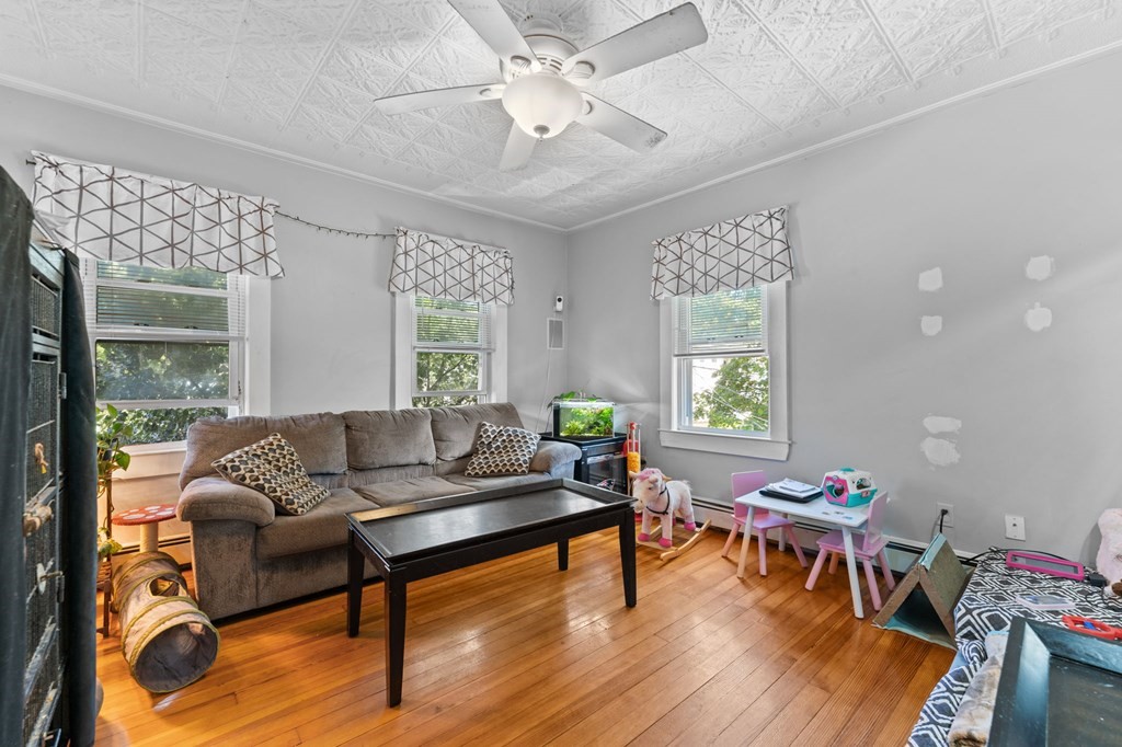 21 Russell Street Taunton, MA 02780 - Photo 21 of 42 a living room with furniture and wooden floor
