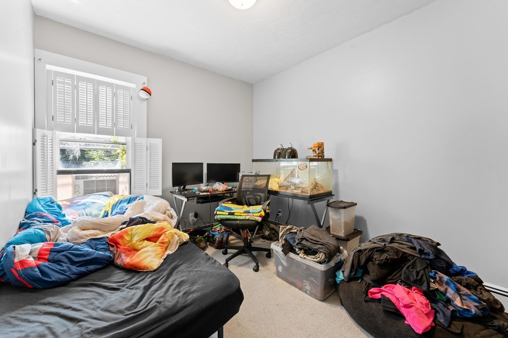 21 Russell Street Taunton, MA 02780 - Photo 24 of 42 a bedroom with bed and a window