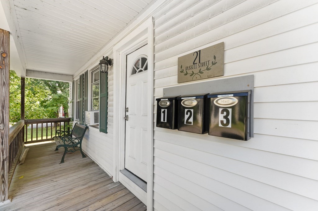 21 Russell Street Taunton, MA 02780 - Photo 4 of 42 a view of front door with wooden floor