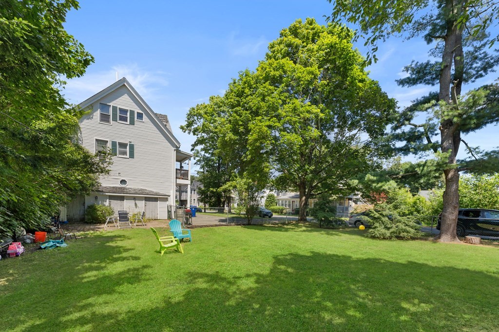 21 Russell Street Taunton, MA 02780 - Photo 41 of 42 a front view of house with yard and green space