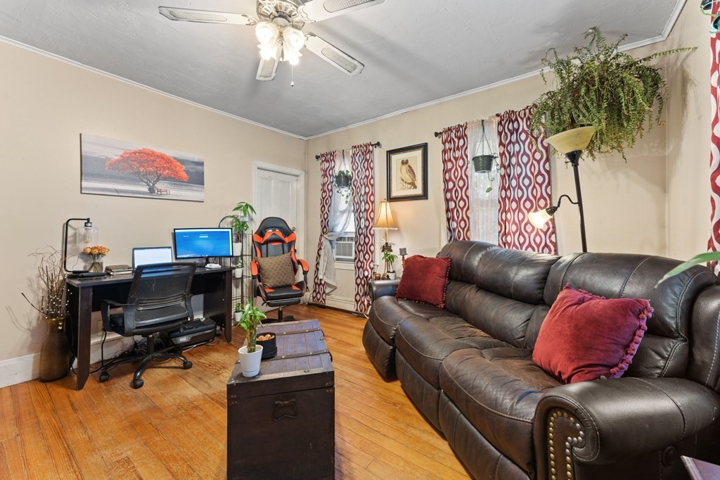 21 Russell Street Taunton, MA 02780 - Photo 7 of 42 a living room with furniture and a flat screen tv