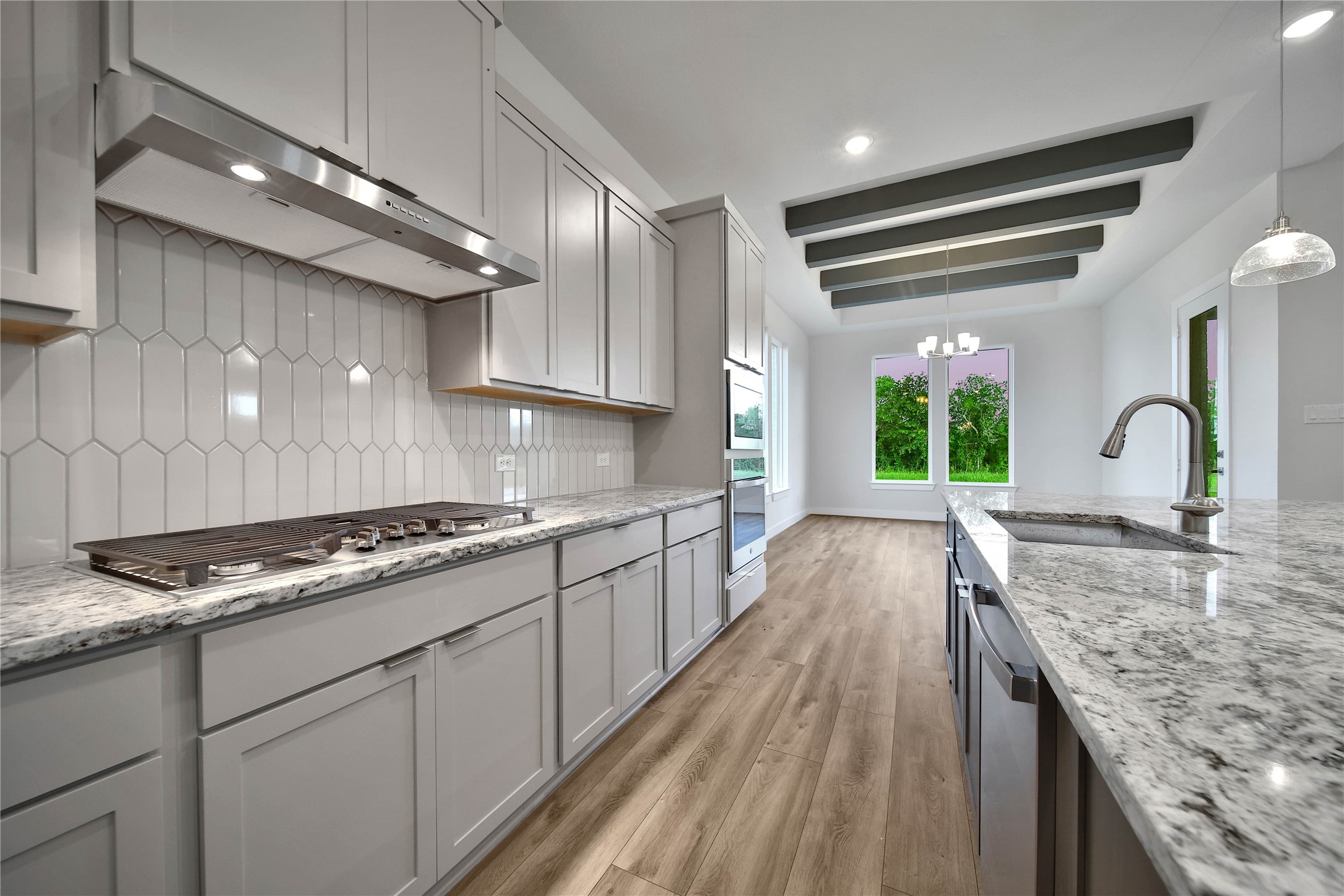 4602 Magnolia Bend Drive Rosharon, TX 77583 - Photo 10 of 39 a kitchen with granite countertop a stove and cabinets