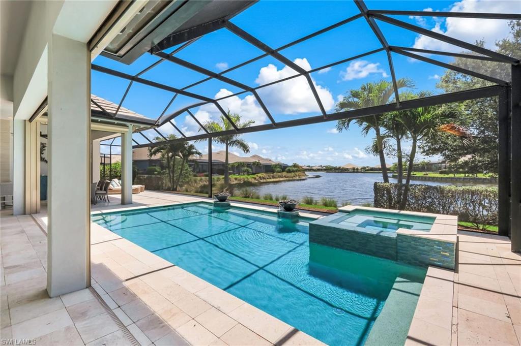 6259 Lightbourn Way Naples, FL 34113 - Photo 3 of 23 Inviting pool and spa with long lake view