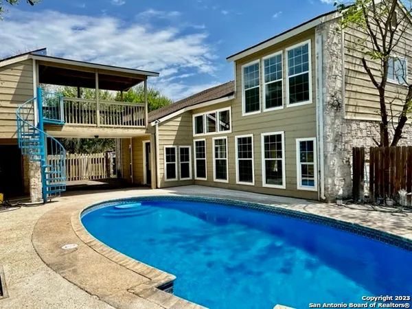 a view of a house with a swimming pool