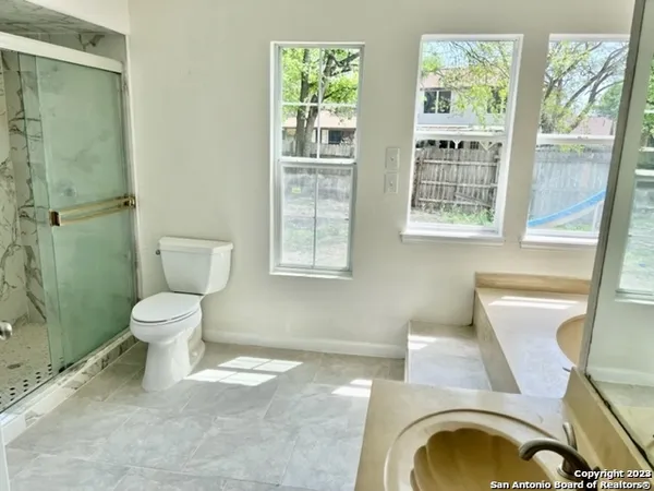 a bathroom with a toilet a sink and a bathtub