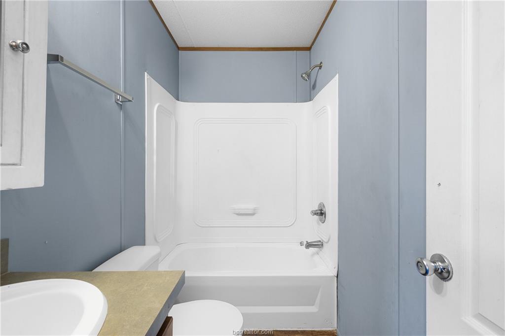 2361 Smetana Road Bryan, TX 77807 - Photo 12 of 32 a bathroom with a toilet and a shower