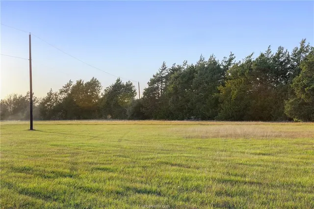 a view of a house with a big yard