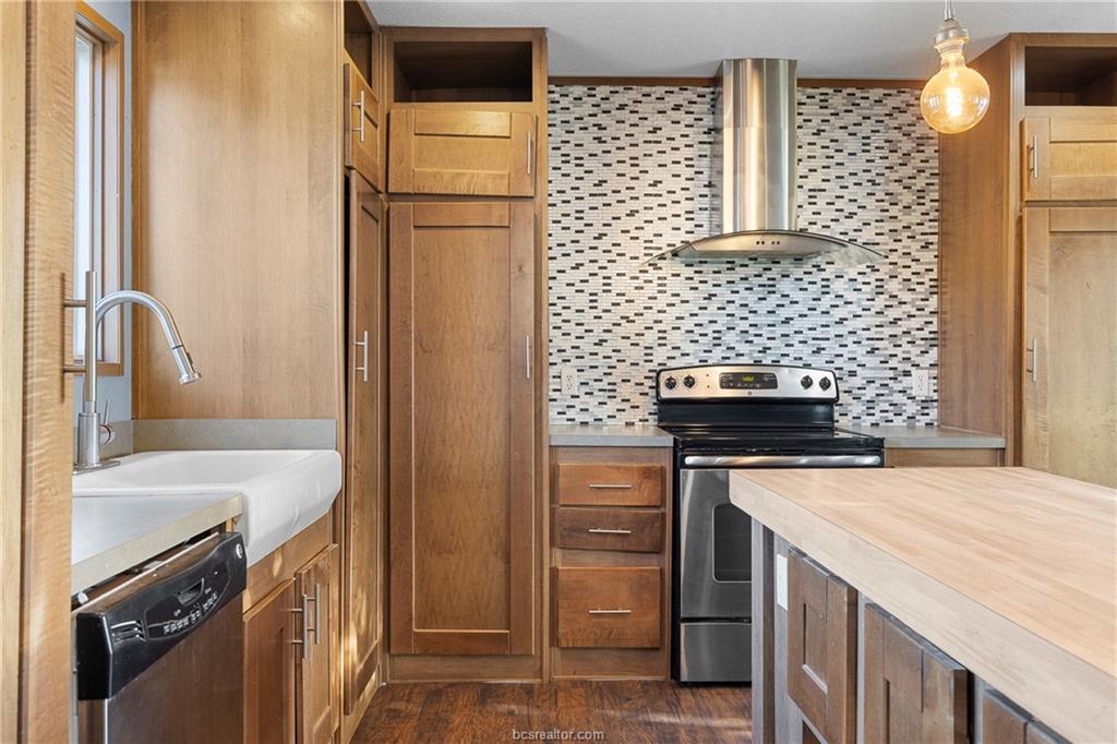 2361 Smetana Road Bryan, TX 77807 - Photo 3 of 32 a kitchen with a stove and a refrigerator