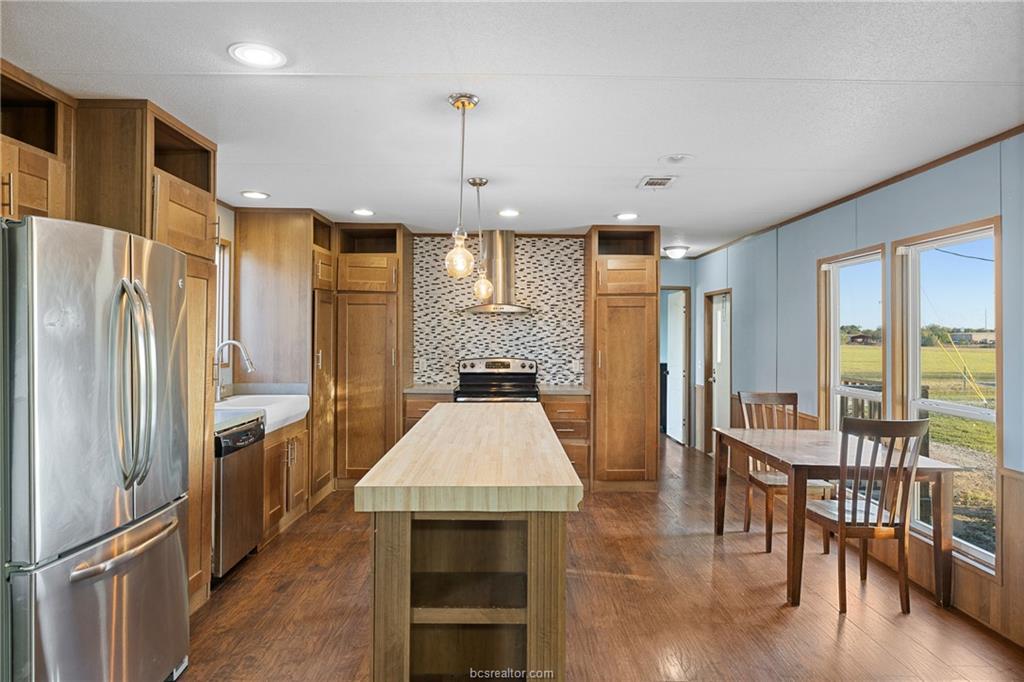2361 Smetana Road Bryan, TX 77807 - Photo 4 of 32 a large kitchen with a large window and stainless steel appliances