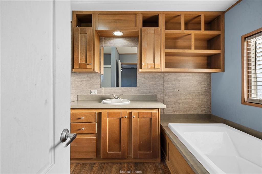 2361 Smetana Road Bryan, TX 77807 - Photo 8 of 32 a bathroom with a sink and a bathtub