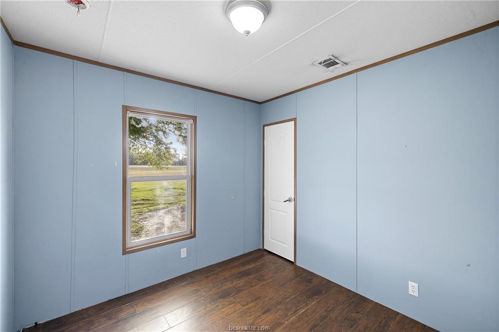 2361 Smetana Road Bryan, TX 77807 - Photo 10 of 32 an empty room with windows and closet
