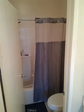 a balcony with table and chairs