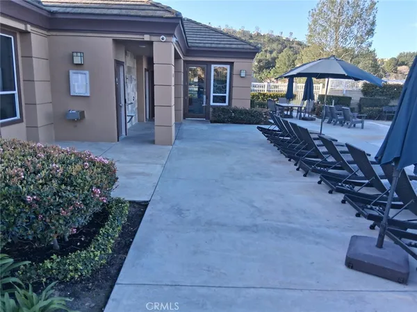 a view of a swimming pool with seating area