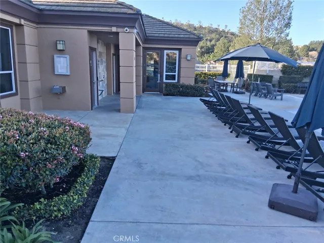 a view of a swimming pool with seating area