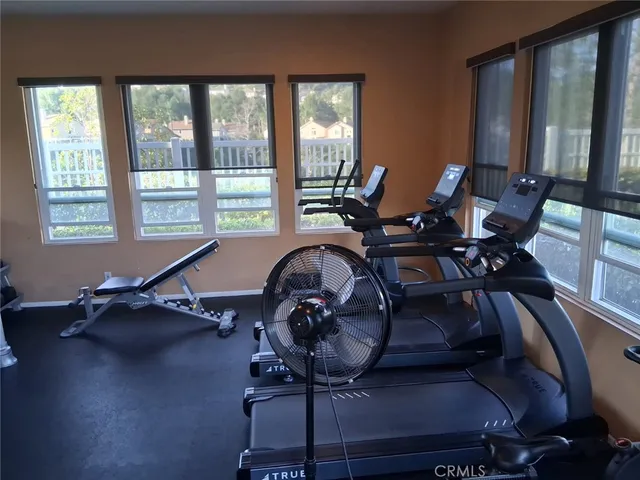 a balcony with table and chairs