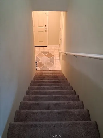 a dining room with furniture and chandelier