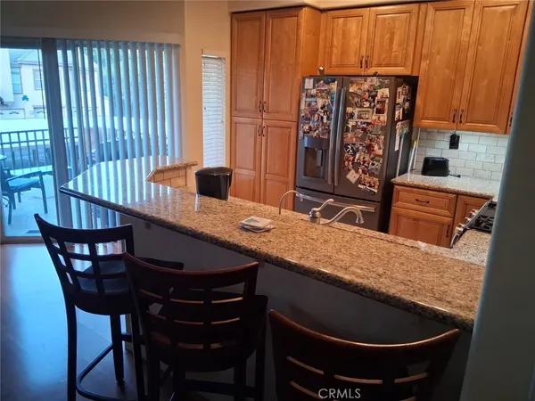 a kitchen with granite countertop a stove top oven a sink dishwasher and granite countertops