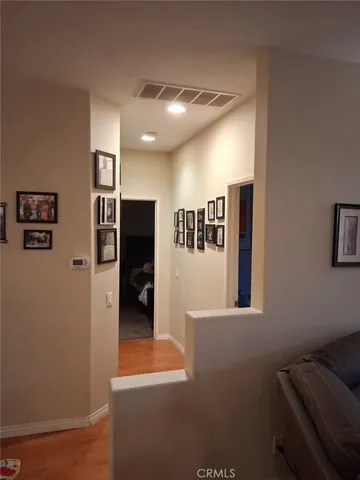 a bedroom with a bed and a mirror