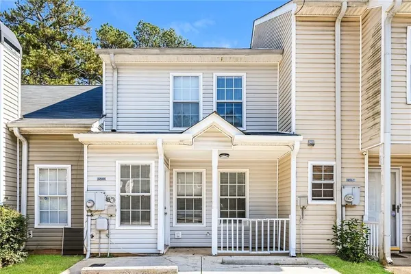 a front view of a house with a porch
