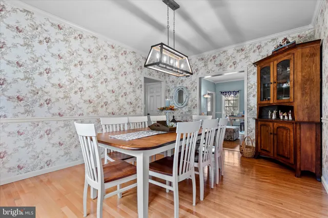 a bedroom with furniture and a book shelf