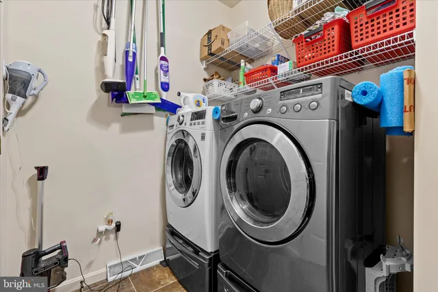 a view of entryway with wooden floor and stairs