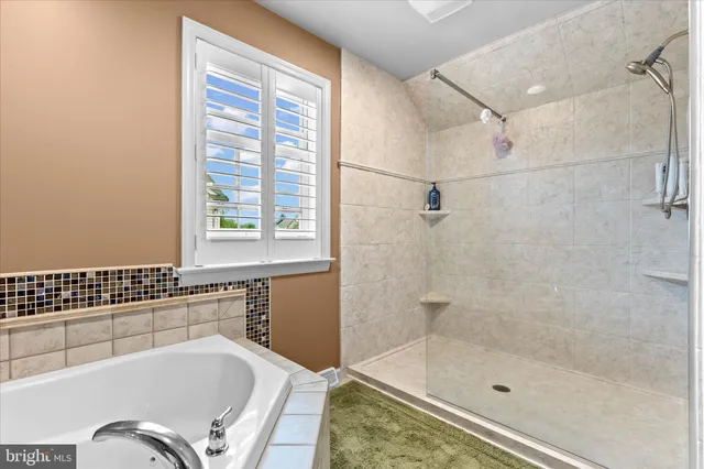 a spacious bathroom with a double vanity sink mirror and