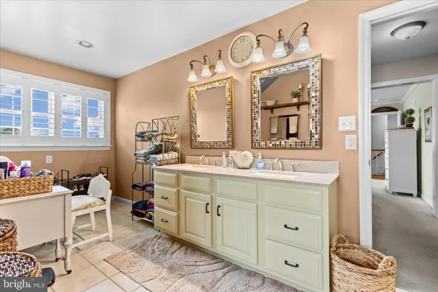 a bathroom with a tub and a window