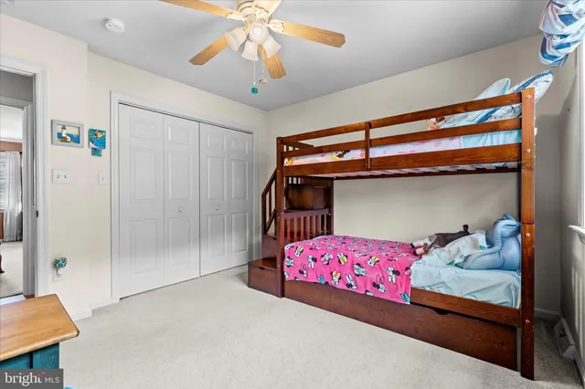 a view of a livingroom with furniture and hardwood floor