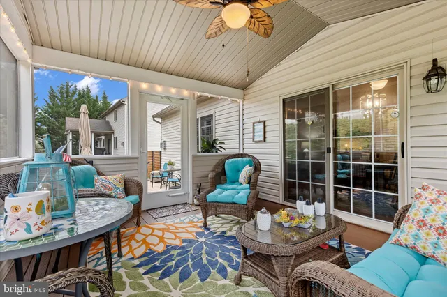 a view of a porch with furniture and a fire pit