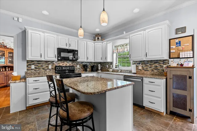 a kitchen with cabinets appliances and a counter top space