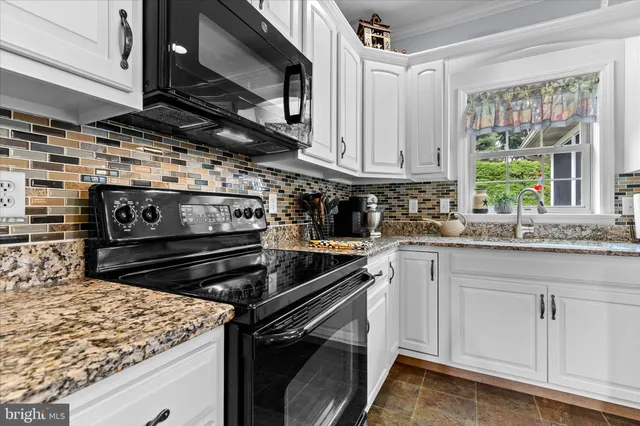 a kitchen with a stove and a sink