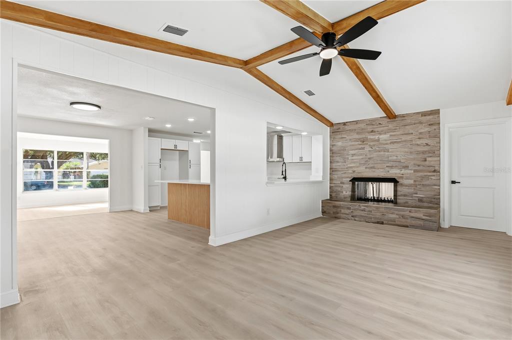 1985 Japonica Road Winter Park, FL 32792 - Photo 11 of 51 a view of an empty room with a fireplace and a window
