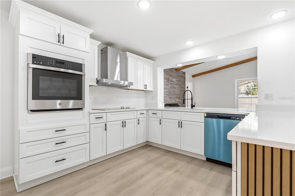 1985 Japonica Road Winter Park, FL 32792 - Photo 17 of 51 a kitchen with granite countertop white cabinets stainless steel appliances and sink