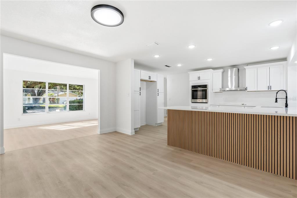 1985 Japonica Road Winter Park, FL 32792 - Photo 20 of 51 a view of kitchen with stainless steel appliances granite countertop cabinets and wooden floor