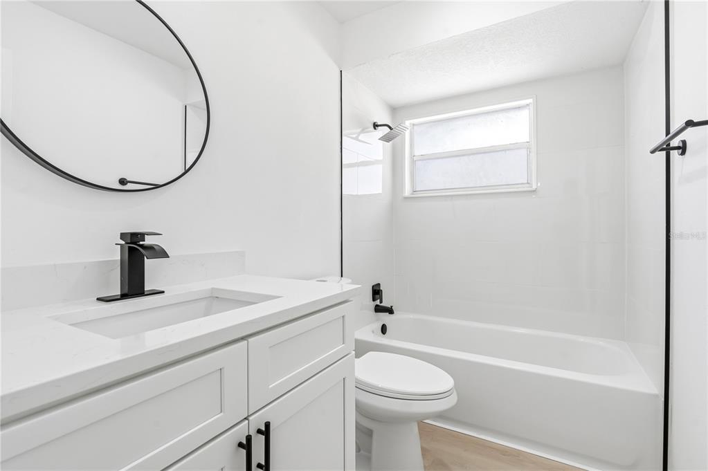 1985 Japonica Road Winter Park, FL 32792 - Photo 24 of 51 a bathroom with a sink a toilet and a mirror