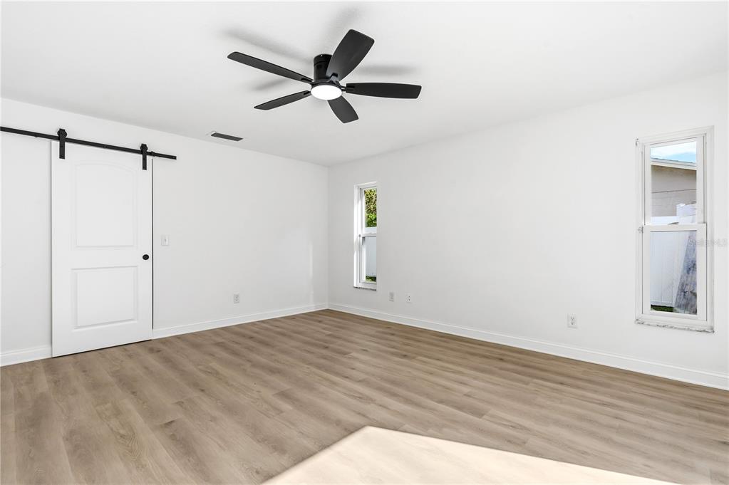 1985 Japonica Road Winter Park, FL 32792 - Photo 26 of 51 a view of a room with wooden floor and white walls